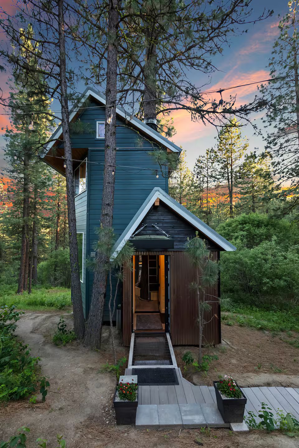 Treehouse entrance at sunset with warm light on handcrafted wood